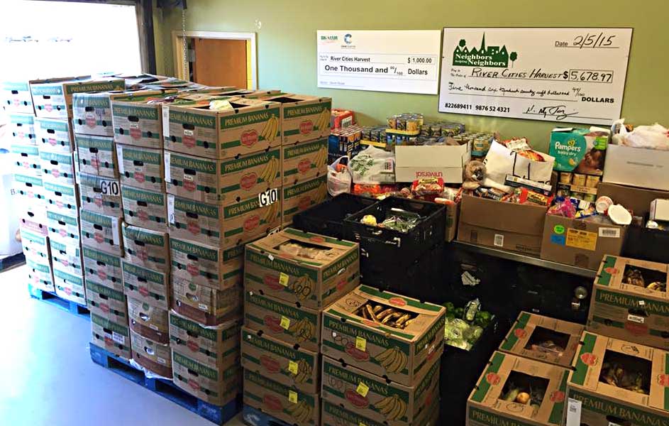 A produce deliver is stacked up at the docking door of River Cities Harvest.